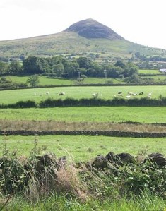Slemish mountain, County Antrim where, it is told, St Patrick worked as a shepherd while a slave Photo:  Man vyi  Wikimedia Commons 